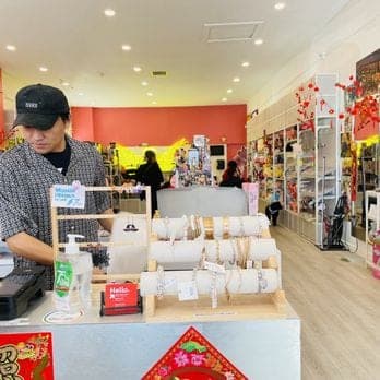 imizzu counter with jewelry displays, wrapping, and the shop beyond