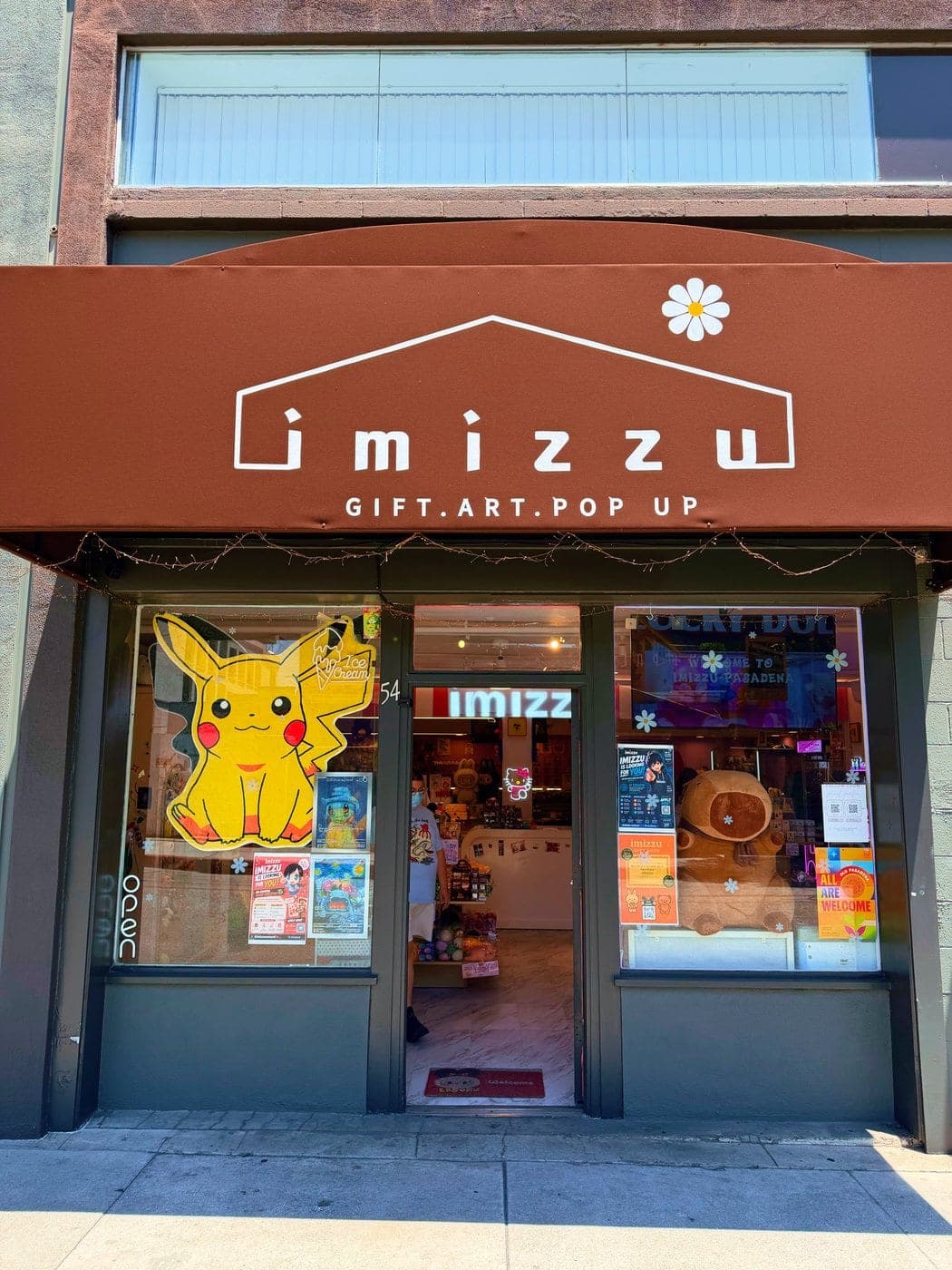 imizzu Pasadena storefront at 54 S De Lacey Ave, watermelon awning and house-frame logo