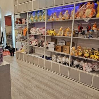 White shelves packed with plush and gift boxes inside imizzu